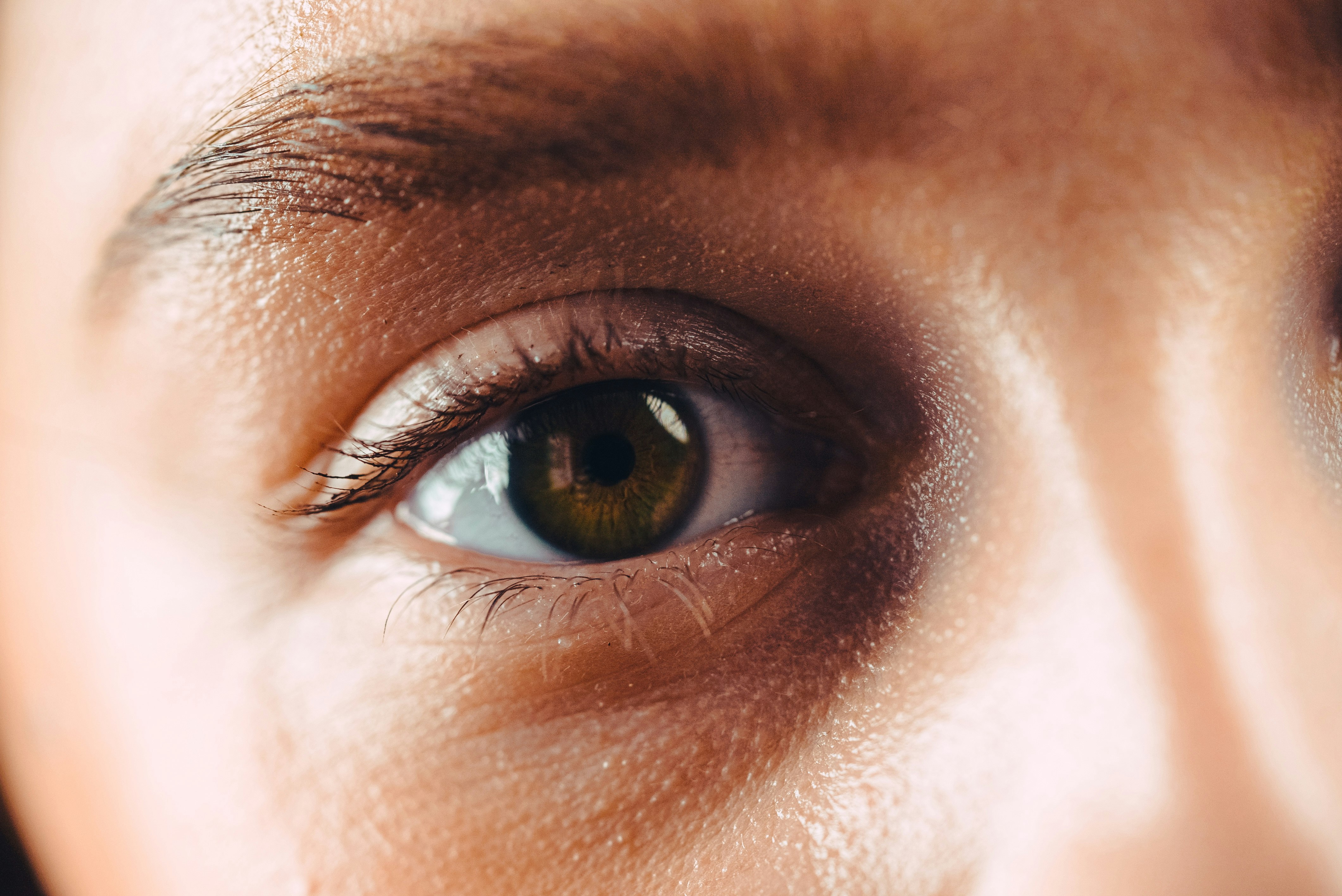 persons eye in close up photography